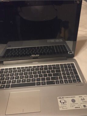 ASUS Silver Laptop with Full Keyboard and Numeric Keypad
